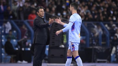 Cristiano Ronaldo greets Riyadh All-Stars' Argentinian coach Marcelo Gallardo after being substituted. AFP