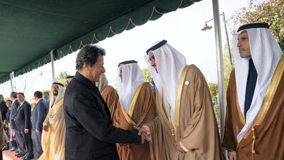 ISLAMABAD, PAKISTAN - January 06, 2019: HE Dr Sultan Ahmed Al Jaber, UAE Minister of State, Chairman of Masdar and CEO of ADNOC Group (2nd R), greets HE Imran Khan, Prime Minister of Pakistan (L), at the Prime Minister's residence. ( Mohammed Al Hammadi / Ministry of Presidential Affairs ) ---