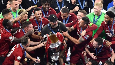 Jurgen Klopp and his Liverpool squad party with the European Cup after winning the Uefa Champions League final. AFP