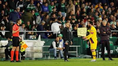 Lionel Messi appeals to the linesman during the match against Real Betis. Reuters