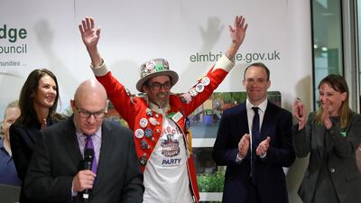 Official Monster Raving Loony Party candidate Baron Badger reacts next to Conservative Party candidate Dominic Raab, Liberal Democrats candidate Monica Harding and independent candidate Kylie Keens during the announcement of voting results for the constituency of Esher and Walton, at a counting centre for Britain's general election in Esher, Britain. Reuters