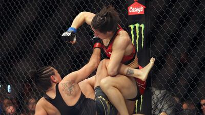 Weili Zhang throws a punch at Carla Esparza during their Women Strawweight fight at UFC 281. Getty