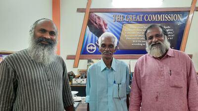 Sajid Thungal, centre, was reunited with his family with the help of Pastor K M Philip, right. They are seen with Pastor Biju Samuel.