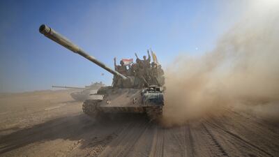Shiite Popular Mobilisation Forces gather with members of the Iraqi Army on the outskirts of Tal Afar. Reuters