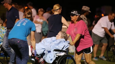 Elderly residents are evacuated. AP Photo/ Waco Tribune Herald / Rod Aydelotte