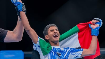 Saif Al Blooshi has his hand raised after winning gold at the IMMAF Youth World Championship at the ADNEC Centre in Al Ain. Picture: UAEJJF