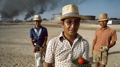 Oil workers on Das Island in 1976 relax with a game of golf. The ‘course’ had one tee, a small square of artificial turf.