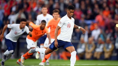 epa07631305 England's Marcus Rashford, right, scores the 1-0 lead from the penalty spot. EPA