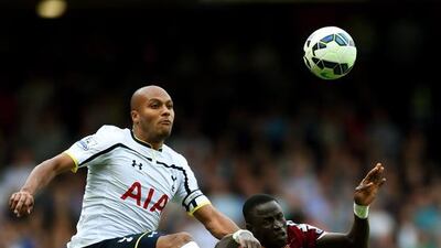 Younes Kaboul of Tottenham Hotspur battles in the air for the ball with Cheikhou Kouyate of West Ham during the Barclays Premier League match between West Ham United and Tottenham Hotspur at Boleyn Ground on August 16, 2014 in London, England. (Photo by Jamie McDonald/Getty Images)