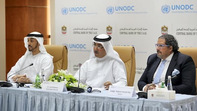 Left to right: Ali Baalawi, acting head of the UAE Central Bank's financial intelligence unit; Saif Al Shamsi, deputy governor of the Central Bank; and Hatem Aly, United Nations Office on Drugs and Crime representative for the GCC, speaking during the press conference held at the Central Bank in Abu Dhabi. Pawan Singh / The National
