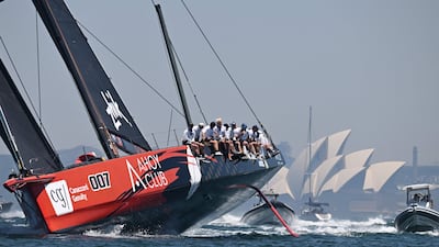 The Master Lock yacht crosses the finish line to win the 2025 SOLAS Big Boat Challenge, at Sydney Harbour. AFP