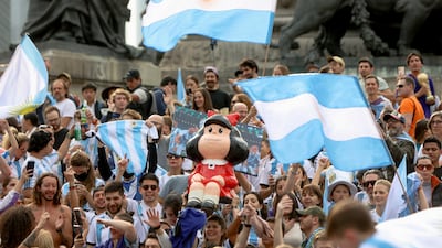 Fans celebrate Argentina's triumph over France in the World Cup final at the Angel of Independence monument in Mexico City, Mexico. Reuters