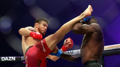 Fabian Edwards blocks a head kick from Johnny Eblen during their bout at Mayadeen Arena. Chris Whiteoak / The National