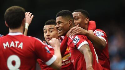 Marcus Rashford of Manchester United, second from right, celebrates with teammates after he scores against Manchester City at Etihad Stadium on March 20, 2016 in Manchester, United Kingdom. (Photo by Michael Regan/Getty Images)