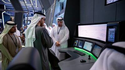 President Sheikh Mohamed visits a booth at Idex