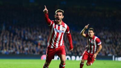 Adrian Lopez of Atletico Madrid celebrates scoring his goal during the Uefa Champions League semi-final second leg match against Chelsea at Stamford Bridge on April 30, 2014 in London, England. Jamie McDonald/Getty Images
