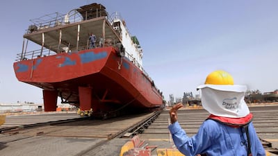Workers move a ship at Drydocks World facilities in Dubai. Jaime Puebla / The National