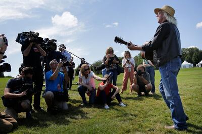 Woodstock veteran Arlo Guthrie played a song this weekend at the original site of the 1969 Woodstock. Seth Wenig / AP