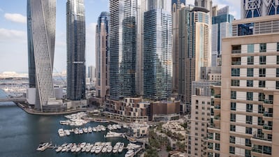 Residential skyscraper buildings in Dubai Marina. The volume and value of real estate transactions in the emirate hit a record high last year. Getty Images