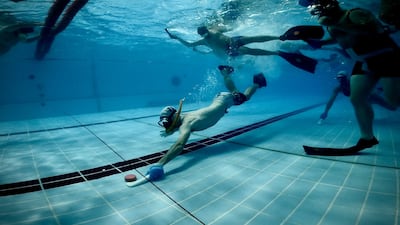 Players wear mouth guards and protective gloves as the puck can move surprisingly quickly in the water.