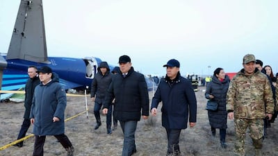 Members of an investigation committee and other officials at the wreck of an Azerbaijan Airlines' Embraer 190 near the airport of Aktau, Kazakhstan, on Thursday. AP
