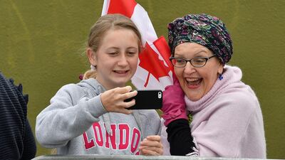 Royal fans takes selfies at the Maranui Cafe. AFP