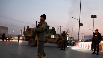 Afghan security forces stand guard at the site of an attack in Kabul. Reuters