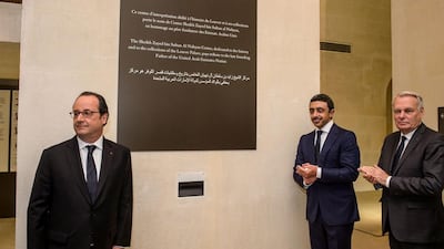 French president Francois Hollande, left, Sheikh Abdullah bin Zayed, centre, and French foreign minister Jean-Marc Ayrault unveil a commemorative plaque. Christophe Petit Tesson / AFP