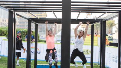 Participants tackle an obstacle course at the closing weekend carnival of the second year of the Dubai Fitness Challenge at Burj Park, Dubai. Leslie Pableo for The National