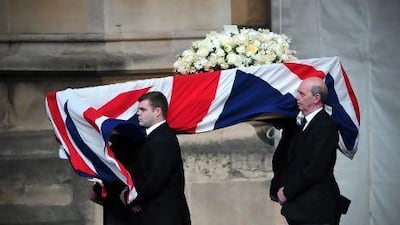 Pallbearers carry the coffin of former British prime minister Margaret Thatcher to the Crypt Chapel of St Mary Undercoft in the Houses of Parliament in London on the eve of her ceremonial funeral.