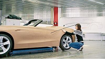 BMW's new wind tunnels allow the car maker to test full-size and clay models on a variety of rolling roads and in different driving situations.