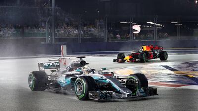 Mercedes driver Lewis Hamilton leads Red Bull's Daniel Ricciardo during the Singapore Grand Prix. Hamilton went on to win the race. Edgar Su / Reuters