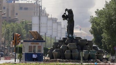 Smoke over Baghdad during an army-imposed curfew, a day after 23 Al Sadr supporters were shot dead. AFP
