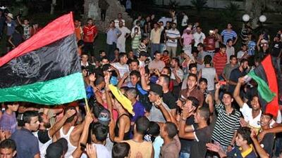Muammar Qaddafi's 42-year rule appears to be over as jubilant Libyan rebels capture his son and take over large areas of Tripoli. Rebels are shown celebrating as they take control of the area of Tripoli known as Tajoura early this morning.