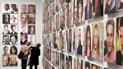 Visitors look at an artwork at Basel Messe on June 13, 2017 in Basel, Switzerland. The art fair has been cancelled for 2020. Getty