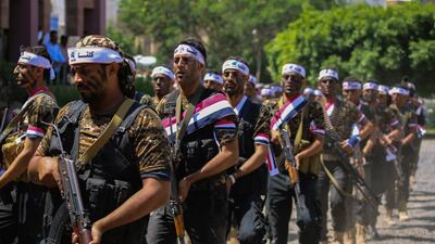 Popular Resistance fighters – loyal to Yemeni president Abdrabu Mansur Hadi – march during a graduation ceremony in Taez on October 8, 2015. Ahmad Al Basha/AFP Photo