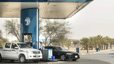Vehicles at a petrol station in Abu Dhabi. Reem Mohammed / The National