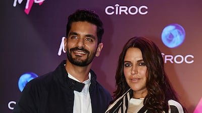 Here, there, everywhere: Neha Dhupia and Angad Bedi. AFP