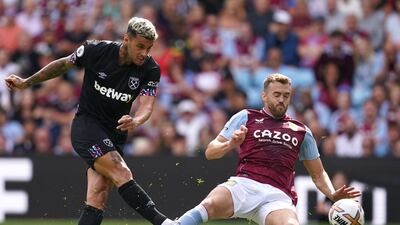 West Ham United's Gianluca Scamacca has a shot at goal under pressure from Aston Villa's Calum Chambers. AP