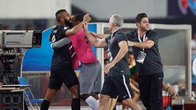 It took a lot of persuasion and manpower from Al Ahli management to pull Salmeen Khamis out of the playing area when the referee gave him his marching orders in Guangzhou, China. AFP