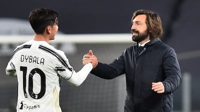 Juventus manager Andrea Pirlo shakes hands with Paulo Dybala after the match. Reuters