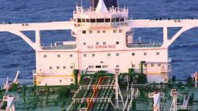 Unidentified people on board the oil tanker MV Sirius Star at anchor off the Somalia coast today.