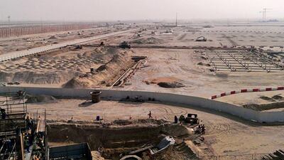 Three parks, designed by architects including Rabben Herman, Gensler, HOK, RTKL, Forrec and Riva Creative, would rise from this patch of desert. Jeff Topping for The National