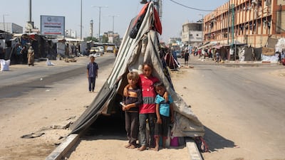 Palestinian children at a makeshift displacement camp along a road in Deir Al Balah in central Gaza. AFP