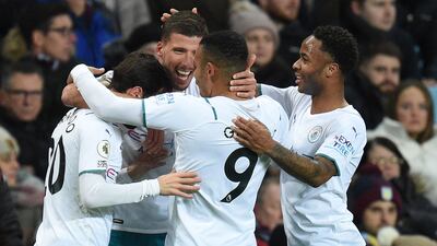 Ruben Dias celebrates with teammates after scoring Manchester City's opening goal. AFP