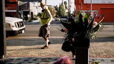A person looks at a makeshift memorial next to Eddie Van Halen's hand prints on Hollywood's Rock Walk in Hollywood, California. EPA