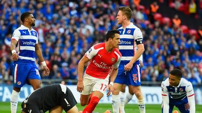 Alexis Sanchez begins to celebrate and Reading players react after he scores one of his two goals on Saturday to lead Arsenal into the FA Cup Final with a 2-1 win. Mike Hewitt / Getty Images / April 18, 2015