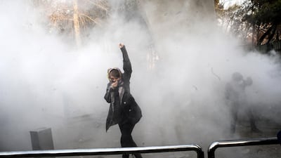 Iranian students clash with riot police during an anti-government protest around the University of Tehran. EPA / STR