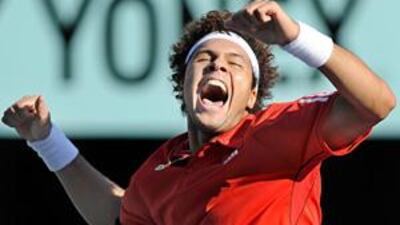 Jo-Wilfried Tsonga celebrates winning his third title of the season after overcoming Mikhail Youzhny 6-3, 6-3 in Japan today.