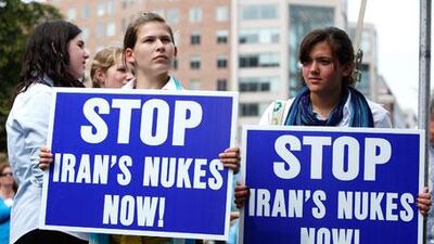 Students Shana Vernon, second right, and Mari Mordfin, right, of Yeshivat Rambam, a Jewish school in Baltimore, hold posters during an anti-nukes rally on September 24, 2009 in Washington, DC.